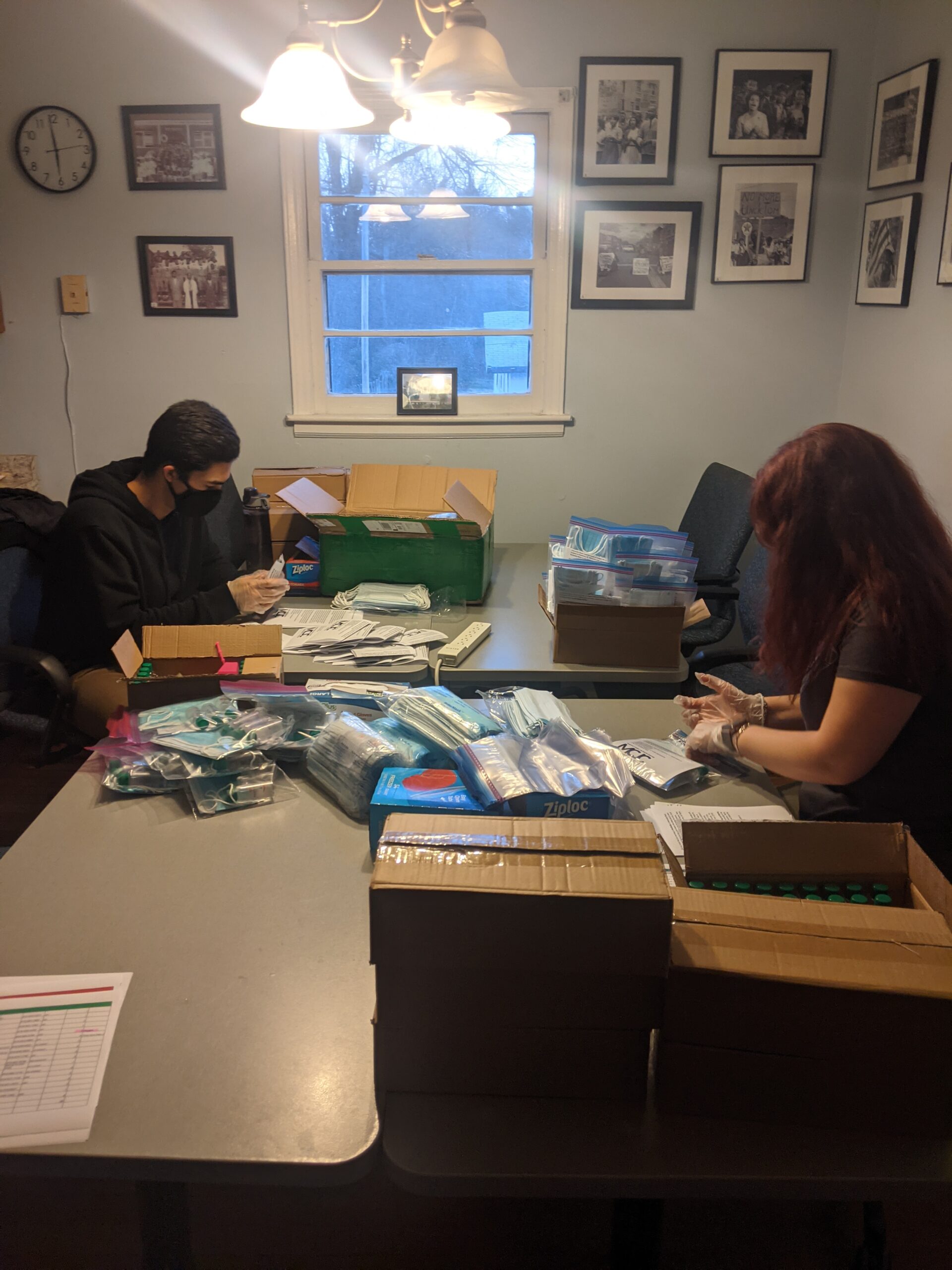 Students assembling COVID care kits for student residents in Northside.